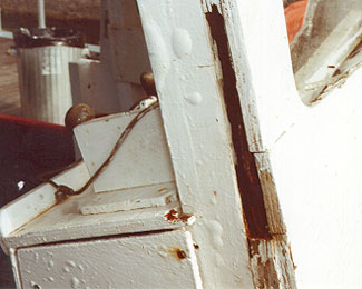 Photo 8 - Disintegration due to dry rot of plywood bridge front in way of front door frame